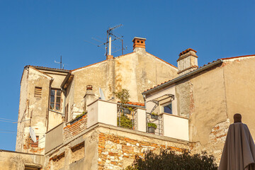 View at mediterrean houses in croatia in early spring against blue sky