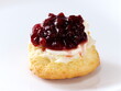 Tokyo, Japan - May 1, 2023: Closeup of a scone and clotted cream and jam on white background
