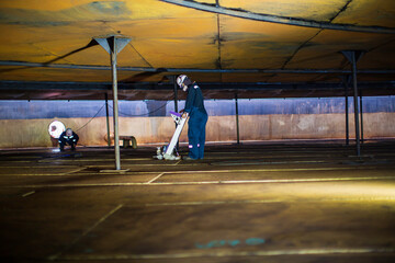 Wall Mural - Male worker inspection floorscan tank