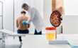 © Peakstock - Urology and treatment of kidney disease. Doctor doing kidney exam for male patient with kidney disease, soft focus