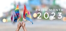 'Pride Month 2023' On Rainbow Flags And Street Bokeh Background, Concept For Lgbtq  People Celebrations In Pride Month, June, Around The World And Calling Out People To Respect Gender Diversity.