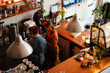 © Drobot Dean - Woman training man with down syndrome to work as barista in coffee shop