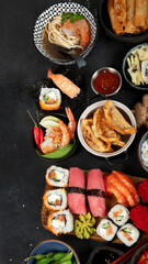 Wall Mural - Traditional Japanese food dishes on black background, top view, copy space