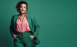 fashion shot of woman with chubby figure in a modern emerald green pant suit on a emerald green background. generative ai