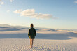© Tetra Images - United States, New Mexico, White Sands National Park, Teenage girl walking