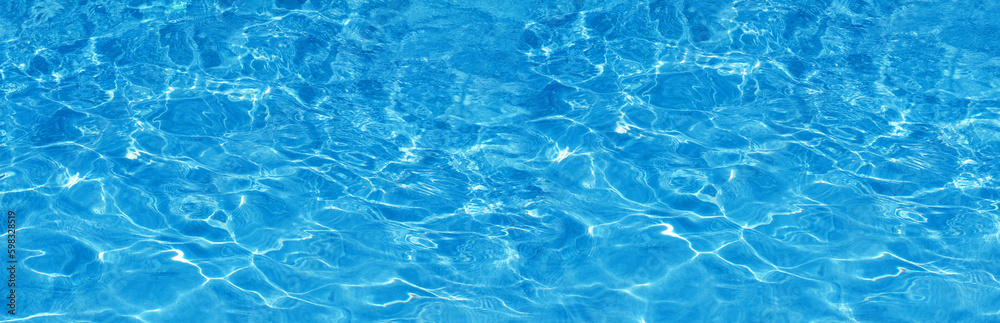 Transparent blue colored clear water surface texture with splashes.  Water background, ripple and flow with waves. Blue water shinning. Sea, ocean surface. Overhead top view. Flat lay design.