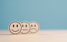 Wooden Label With Happy Normal And Sad Face Icons For Experience Survey Services And Products Review Concept. Customer Or Client Show Good Neutral Or Negative Feedback And Satisfaction Rating.