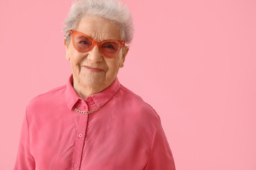 Sticker - Senior woman on pink background, closeup