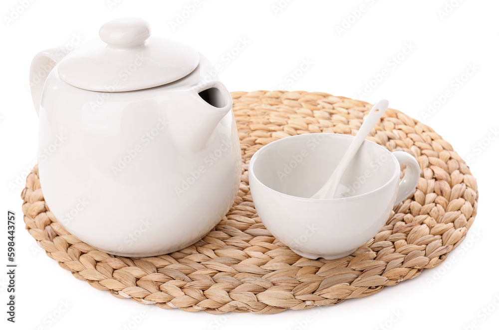 Wicker mat with teapot and cup isolated on white background