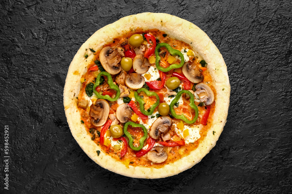 Vegetable pizza on dark background