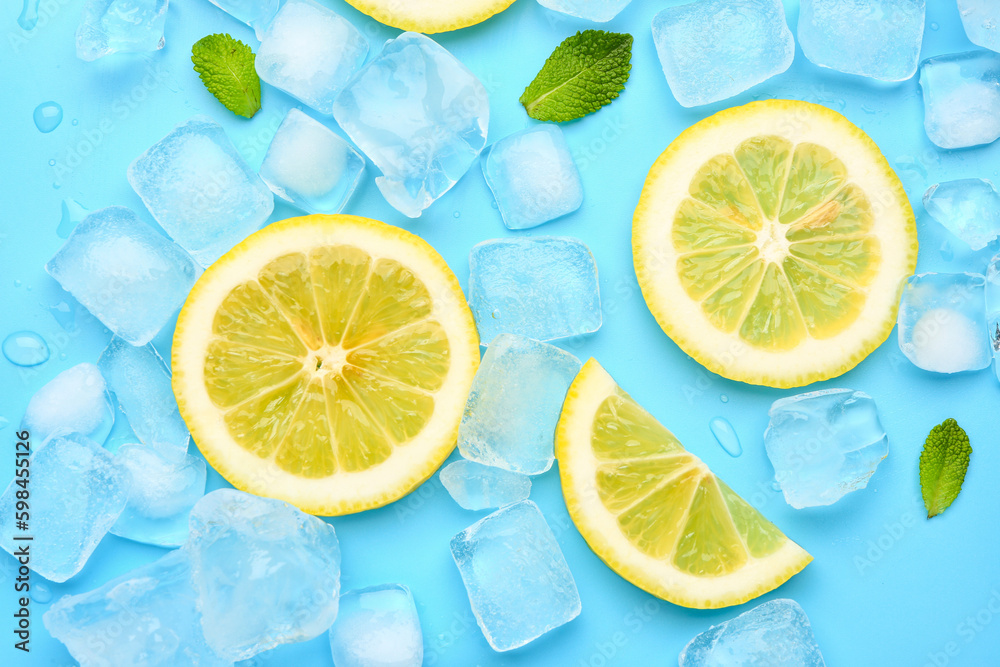 Sliced fresh lemon and ice on blue background