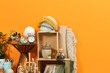 © New Africa - Many different items near orange wall. Garage sale
