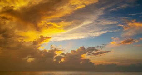 Wall Mural - Dramatic dark clouds background,Beautiful 4K Time lapse of Majestic sunrise or sunset clouds sky landscape,Amazing light of nature cloudscape sky and Clouds moving away rolling,Dark cloud timelapse