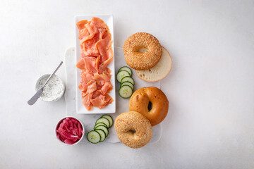 Wall Mural - Freshly baked bagels served with dill cream cheese and salmon