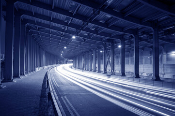 Poster - light trails and head lights of traffic in tunnel