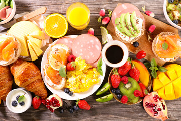 Poster - Brunch- fried egg, toast, fruit and coffee cup assortment on table