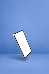 Wall Mural - Floating smartphone isolated on blue. Vertical background