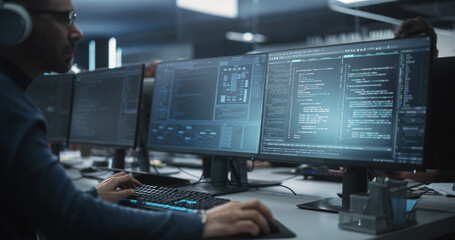 Close Up of a Software Developer Working on a Desktop Computer, Implementing New Features and Updates to a Company Server. Stylish Specialist Typing on Keyboard