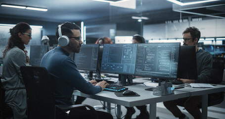 Leinwandbilder - Team of Talented Young Professionals Working in a Technological Research and Development Agency. Young Female Developer Working with AI Software and Mapping Technical Neural Network Data Set