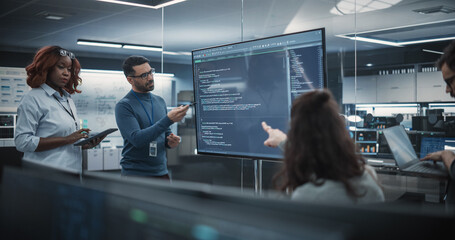 Wall Mural - Team of Diverse Software Developers Having a Meeting in Order to Review the Code Done by Computer Engineering Department. Manager Making a Presentation for Project Managers at the Office