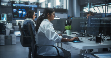 Aufkleber - Diverse Young Indian Colleagues Working on Computers in a Research Laboratory. Focus on Female Software Developer Colleague Working on a Solution for Their Collaborative Industrial Tech Project