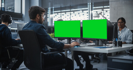 Poster - Team of Talented Young Indian Professionals Working in a Technological Research and Development Agency. Computer Screens with Green Screen Mock Up Display