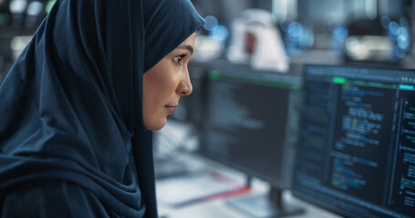 Poster - Portrait of a Smart Focused Middle Eastern Engineer Working on Computer in a Technological Corporate Office. Young Arab Woman in Hijab Developing Software for an Innovative Internet Service Provider