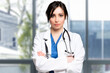 © Minerva Studio - Smiling female doctor in a modern clinic