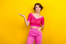 Portrait Of Adorable Gorgeous Positive Lady Wear Stylish Outfit Showing Empty Space Summer Sale Isolated On Yellow Color Background Generative AI