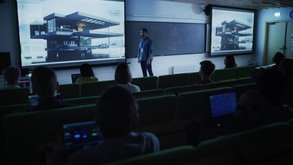 Poster - Young Male Teacher Giving a Residential Architecture Lecture to Diverse Multiethnic Group of Female and Male Students in Dark College Room. Projecting Slideshow with a Private Housing Project