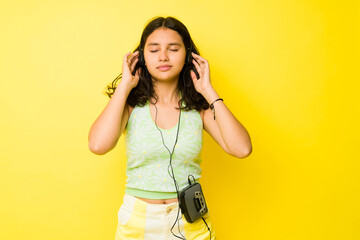 Relaxed teen girl using a vintage music player