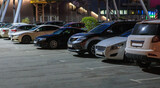 Fototapeta Miasto - Cars in the parking lot at night