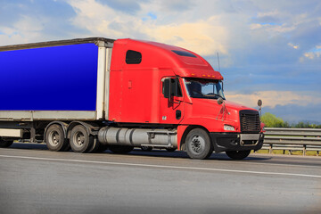 Canvas Print - American Truck Drives on a Country Road