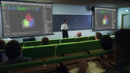 Poster - Young University Professor Explaining the Importance of Artificial Intelligence to a Group of Diverse Students in a Modern Auditorium. Female Teacher Showing Neural Network System on Two Big Screens