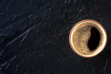 Poster - Coffee cup, top shot on a black slate background with a place for text, espresso drink in a simple mug