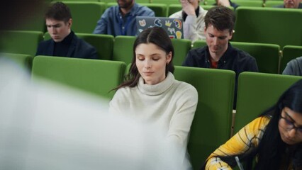 Poster - Diverse Multicultural Students Studying in University Room, Listening to a Professor Giving a Lecture. Smart Enthusiastic Young Adults Sitting in Classroom. Over the Shoulder Footage