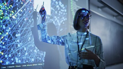 Fototapete - Young Female Teacher Giving a Data Science Presentation in a Dark Auditorium with Projecting Slideshow with Artificial Intelligence Neural Network Architecture. Business Startup and Education Concept