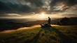 © Matyfiz - Photo of Low angle shot of a man mowing a hillside with a push mower, with a view of the green valley below and a dramatic sunset sky. Generative AI