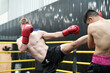 © FotoArtist - Young active athlete exercising on cross training equipment in fitness center or gym