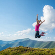 © nickolya - Young woman jumping in the mountains