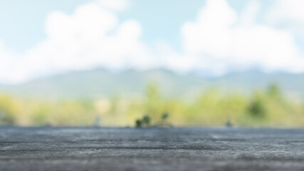 Wall Mural - Empty, no people. Focus soft spot on the wooden table. Abstract natural cloud blue sky and mountain background. For use. The place for use product.
