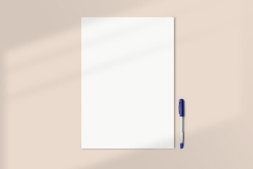 Realistic A3 paper flatlay mockup with a pen. Portrait big paper A3 International Paper Size mockup top view. Simple, clean, modern, minimal poster mock up flat lay concept