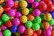 © Olga - Lots of Pickleball multicolored sports balls. 3D rendering close up