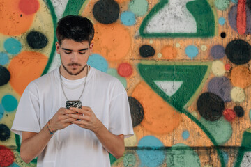 Wall Mural - young man with mobile phone