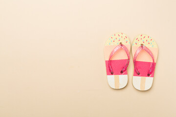 Wall Mural - Bright flip flops on color background, top view