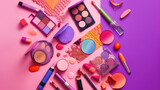 Fototapeta Dinusie - cosmetics and makeup products scattered on a pink background