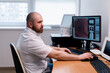 © Guys Who Shoot - the patient undergoes computed tomography in the clinic the radiologist monitors the procedure and the results of the scan