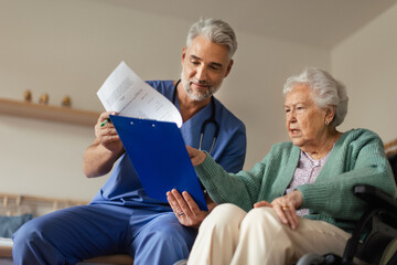 Poster - Caregiver doing regular check-up of senior woman in her home.