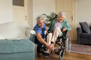 Wall Mural - Caregiver doing regular check-up of senior woman in her home.