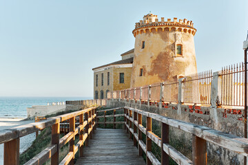 Wall Mural - Wooden boardwalk lead to the Torre de la Horadada